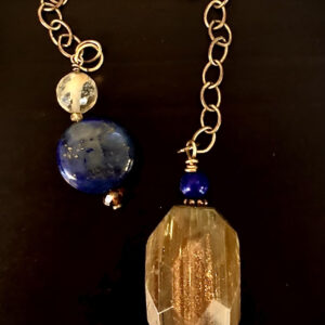 Pendulum-Rutilated Quartz stone with gold tones and a lapis bead